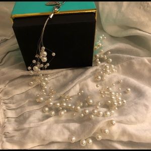 Seed pearls strung on clear line